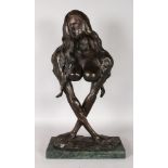 A GOOD LARGE ABSTRACT BRONZE STANDING NUDE. Signed, on a marble base. 26ins high.