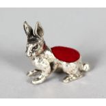 A MINIATURE SILVER RABBIT PIN CUSHION.