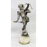 A GOOD LEAD GARDEN FIGURE, modelled as cupid, on a circular base. 3ft 5ins high (including base).