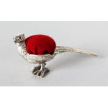 A MINIATURE SILVER PHEASANT PIN CUSHION.