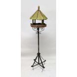 A WROUGHT IRON AND WOODEN BIRD TABLE. 6ft high.
