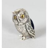 A MINIATURE SILVER OWL PIN CUSHION.