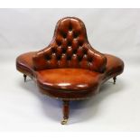 A SUPERB QUALITY STUDDED LEATHER CONVERSATION SEAT on turned legs with brass castors.