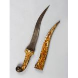 A RARE ISLAMIC KNIFE with engraved gold inlaid blade, in a metal sheath decorated with figures. 19.