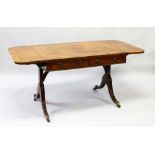 A GOOD REGENCY SOFA TABLE with folding flaps, crossbanded top, two frieze drawers, end supports