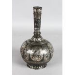 A PERSIAN SILVER INLAID METAL BOTTLE VASE. 10ins high.