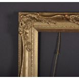 20th Century English School. A Gilt Composition Frame, with Pierced Centres and Corners, 18" x 12".