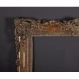 20th Century English School. A Swept, Pierced Gilt Composition Frame, 24" x 19.5".