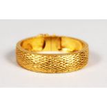 A CHINESE GOLD BANGLE. 40gms. In Hong Kong box.