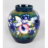 A MOORCROFT BULBOUS "ORCHID" VASE, on a greeny-blue ground. Impressed MOORCROFT. Blue script