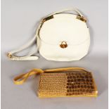 A GOLD LEATHER EVENING BAG, with sequinned front, and CREAM LEATHER SHOULDER BAG.