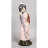 A LLADRO FIGURE "CHRYSANTHEMUM". First issued 1978, last year 1998. 11.5ins high.