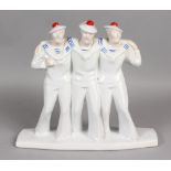 AN ART DECO DESIGN BLUE AND WHITE GROUP OF TWO SAILOR BOYS on a rectangular base. 11ins high.