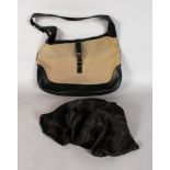 A GUCCI BLACK LEATHER AND TAN CANVAS HANDLES including DUST BAG.