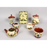 A TORQUAY TEAPOT, COFFEE POT, JARDINIERE, PLAQUE, VASE AND TWO SMALL JUGS.