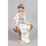 A LLADRO FIGURE "NIPPON LADY". First issued 1985, last year 1998. 9ins high. Fan missing.