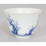 A GOOD QUALITY CHINESE BLUE & WHITE PORCELAIN MONTH CUP, decorated with blossoming boughs, a poem