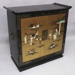 A 20TH CENTURY CHINESE ONLAID LACQUERED WOOD DRINKS CABINET, the two front doors decorated with a