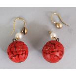 A PAIR OF CHINESE RED CINNABAR LACQUER SPHERICAL EARRINGS, each 0.6in diameter.