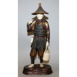 A GOOD SIGNED JAPANESE MEIJI/TAISHO PERIOD LACQUERED WOOD & IVORY SECTIONAL FIGURE OF A FISHERMAN,