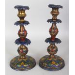 A PAIR OF ENAMELLED METAL OTTOMAN CANDLESTICKS, with patterned decoration in vivid colouring, 10.