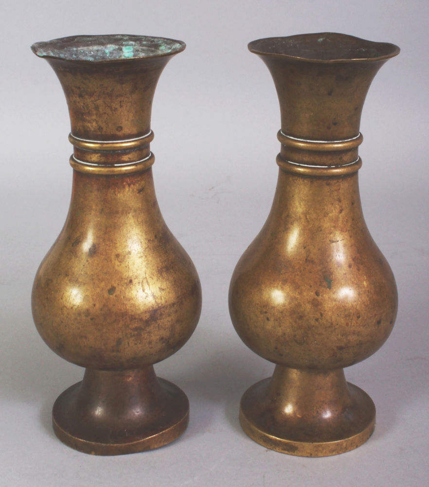 A PAIR OF 18TH CENTURY CHINESE BRONZE VASES, each supported on a high flared foot and with a - Image 2 of 4