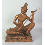 A LARGE 19TH/20TH CENTURY THAI GILDED & LACQUERED BRONZE FIGURE OF A SEATED MUSICIAN, seated in a