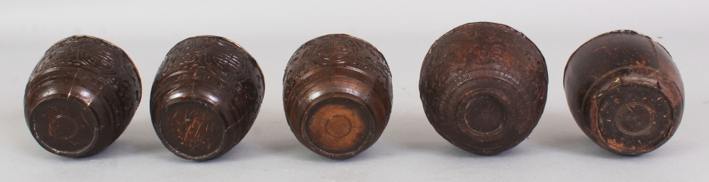 A GROUP OF FIVE 19TH CENTURY CHINESE COCONUT CUPS, with fitted silver liners some bearing an - Image 10 of 10