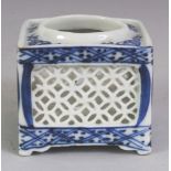 A SMALL EARLY 20TH CENTURY JAPANESE BLUE & WHITE SQUARE SECTION PORCELAIN INCENSE POT, with