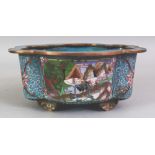 A CHINESE CLOISONNE JARDINIERE, supported on ruyi feet, the sides with panels of storks reserved