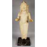 A LARGE INDIAN MARBLE STATUE OF LAXMI, the goddess mounted on a square hardstone plinth, 31.6in