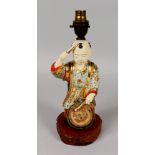 AN EARLY/MID 20TH CENTURY JAPANESE SATSUMA STYLE CERAMIC FIGURE OF A BOY DRUMMER, fitted for