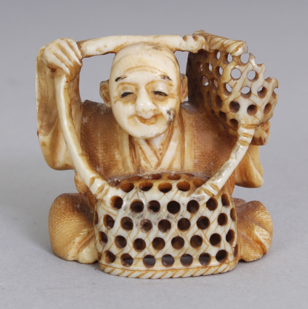 A SIGNED JAPANESE MEIJI PERIOD IVORY NETSUKE OF A SEATED BASKET SELLER, the base with an engraved