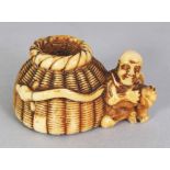 A GOOD QUALITY SIGNED JAPANESE MEIJI PERIOD IVORY NETSUKE OF A FISHERMAN, seated by his creel