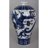 A CHINESE MING STYLE BLUE & WHITE MEIPING PORCELAIN DRAGON VASE, decorated with a sinuous dragon