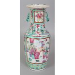A 19TH CENTURY CHINESE CANTON FAMILLE ROSE PORCELAIN VASE, painted with two interior scene panels of