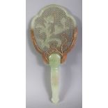 A CHINESE CELADON JADE & GILT METAL HAND-MIRROR FORM MODEL, carved with a floral spray, the