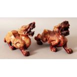 A PAIR OF CHINESE SOAPSTONE STYLE MODELS OF PIXIU MYTHICAL CREATURES, 5.9in long & 3.75in high.