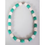 A MALACHITE & ROCK CRYSTAL NECKLACE, composed of shaped oblong beads, approx. 19.25in long.