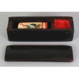 A SMALL EARLY 20TH CENTURY IVORY SEAL IN A FITTED RHINO HORN RECTANGULAR BOX, with sliding cover,
