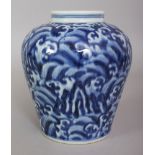 A CHINESE MING STYLE BLUE & WHITE PORCELAIN JAR, decorated with an overall design of crashing