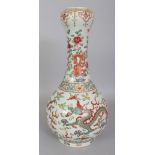 A CHINESE WANLI STYLE WUCAI PORCELAIN BOTTLE VASE, with a garlic mouth, the sides decorated with