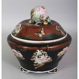 A CHINESE FAMILLE ROSE MOULDED PORCELAIN BOWL & COVER, supported on ruyi feet, the moulded floral