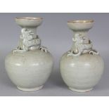A PAIR OF CHINESE SOUTHERN SONG DYNASTY LONGQUAN CELADON DRAGON VASES, each waisted neck moulded