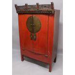 ANOTHER LARGE EARLY 20TH CENTURY CHINESE RED GROUND LACQUERED WOOD CABINET, with an elaborately