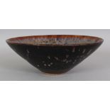 A CHINESE SONG STYLE JIZHOU PAPERCUT CERAMIC BOWL, the interior decorated with three mythical