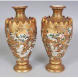 A PAIR OF SIGNED JAPANESE MEIJI PERIOD SATSUMA EARTHENWARE VASES, each painted and gilded with