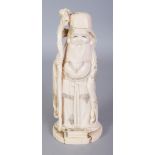 A GOOD SIGNED JAPANESE MEIJI PERIOD IVORY OKIMONO OF FUKUROKUJU, standing and holding a knarled