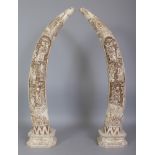 A LARGE PAIR OF CHINESE SECTIONAL BONE MODELS OF TUSKS, each carved in deep relief with a