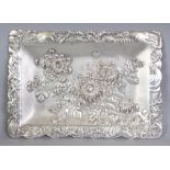 AN EARLY 20TH CENTURY JAPANESE EMBOSSED WHITE METAL RECTANGULAR TRAY, weighing approx. 939gm, the